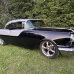 1955 Pontiac Chieftain, front three-quarter view from the passenger side showing the chrome grille and bumper
