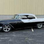 1955 Pontiac Chieftain, driver side profile showing the two-tone paint and polished five-spoke wheels