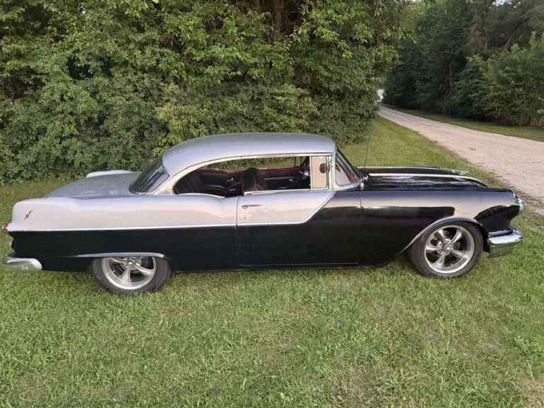 1955 Pontiac Chieftain, passenger side profile showing the red interior through the hardtop side glass