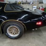 Gold snowflake wheel and BFGoodrich Radial T/A tire on a 1979 Pontiac Trans Am SE