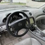Grey leather interior and dashboard of a 2004 Mercedes-Benz SL55 AMG