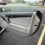 Driver door panel of a 2004 Mercedes-Benz SL55 AMG in grey leather