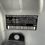 Door jamb VIN plate reading WDBSK74F24F071938 on a 2004 Mercedes-Benz SL55 AMG