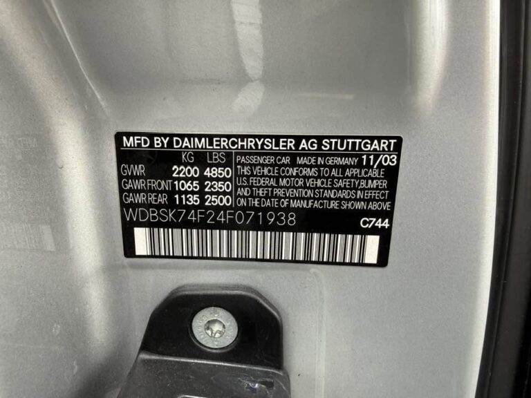 Door jamb VIN plate reading WDBSK74F24F071938 on a 2004 Mercedes-Benz SL55 AMG