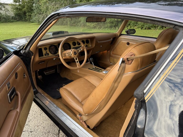 1979 Pontiac Firebird Trans Am SE interior from the driver door, camel leather with gold trim