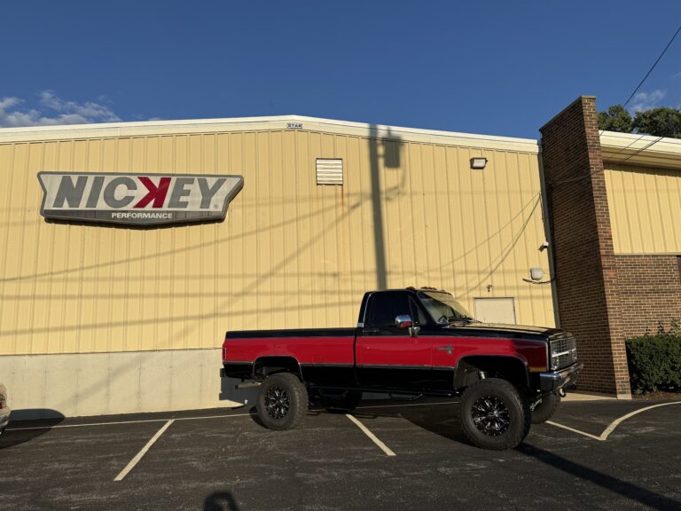1983 Chevrolet K20 Silverado 4x4 parked beneath the Nickey Performance sign