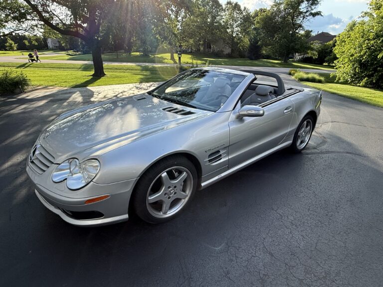 2004 Mercedes-Benz SL55 AMG in silver, front three-quarter view with the top down